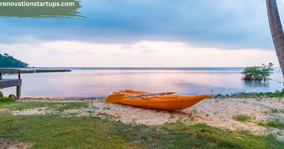Kayak on Couture Beach Lakeshore sandy shore with calm lake waters wooden dock and lush greenery at sunset Ontario 