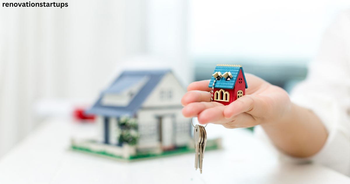 houses for rent – hand holding miniature house keychain with keys