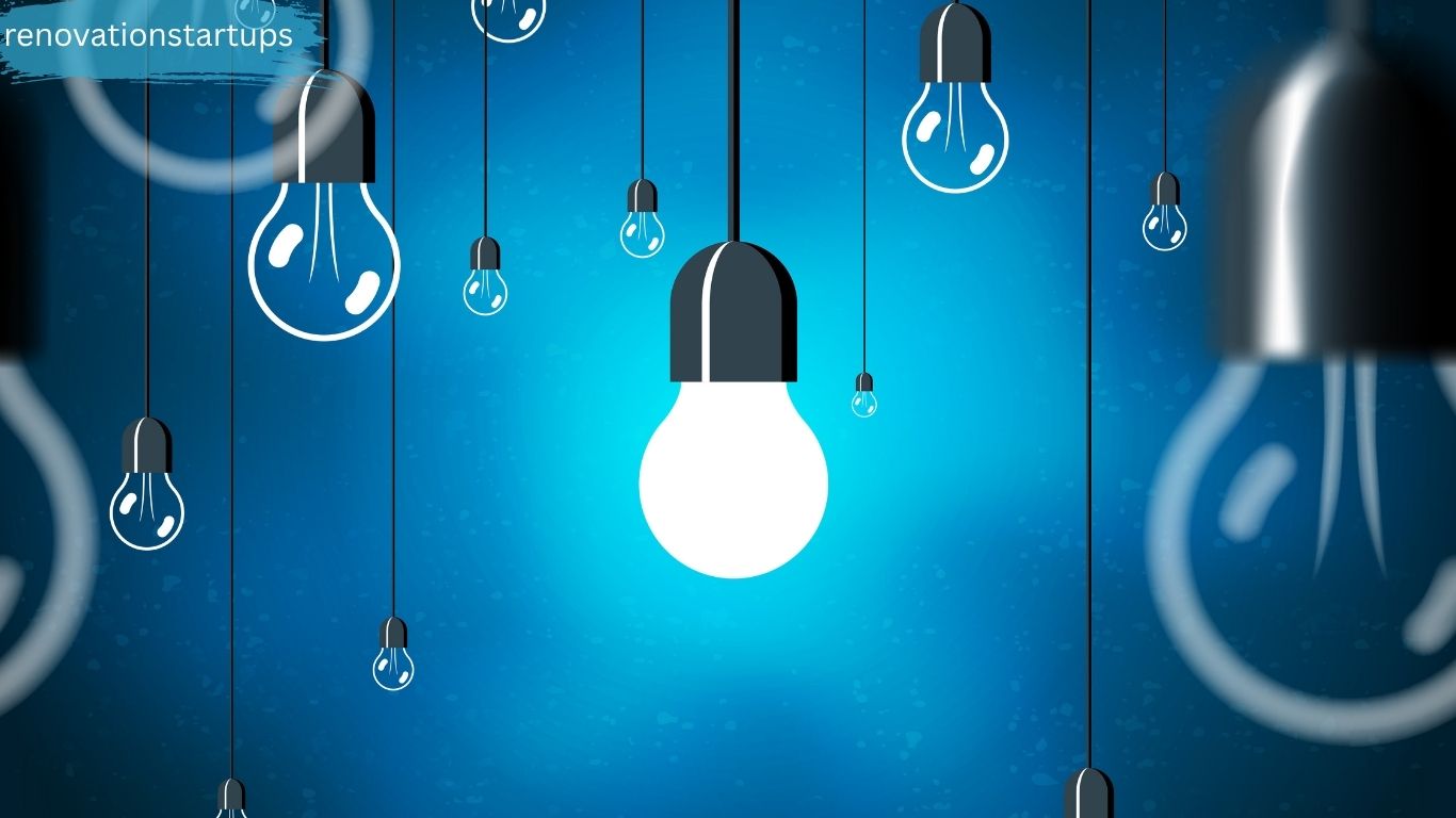 One bright glowing LED light bulb surrounded by unlit light bulbs hanging on blue background