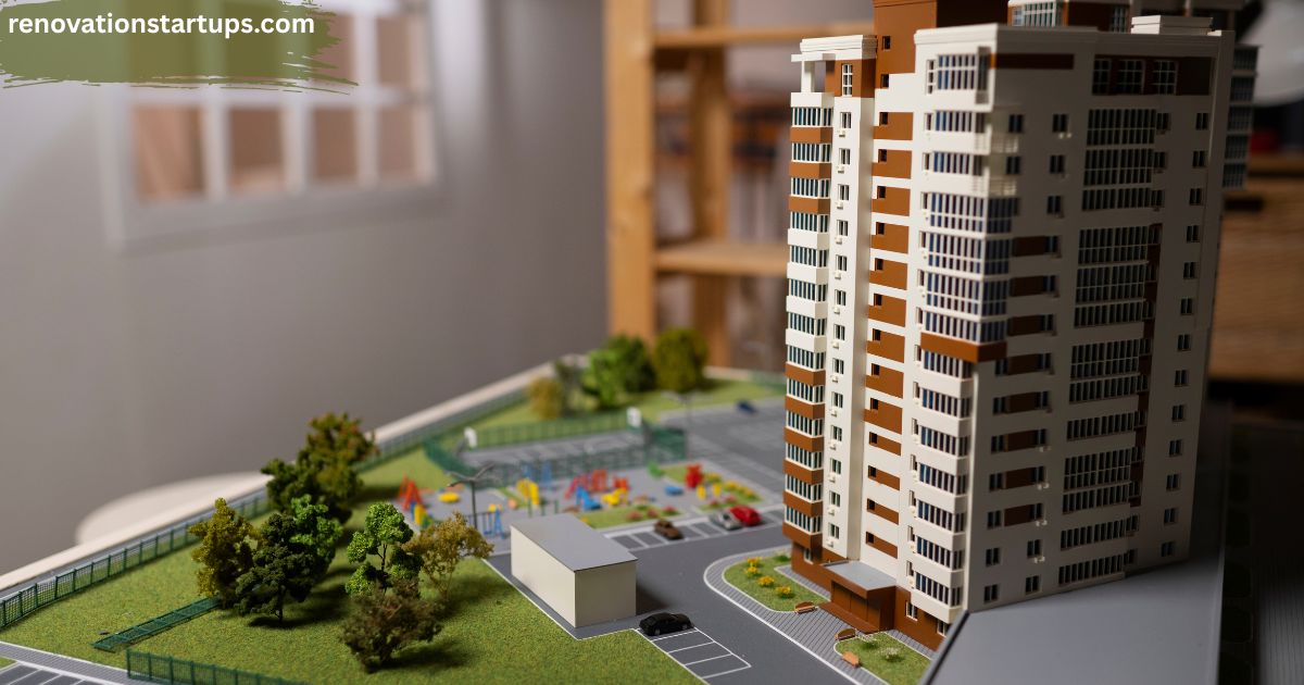 An architectural 3D miniature model of a modern high-rise development illustrating premium condos for sale in Winnipeg with integrated parking, green space, and a community playground area.
