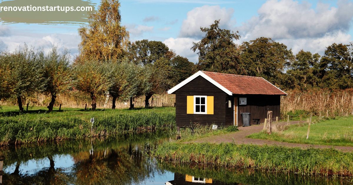 Cozy wooden cabin beside a calm creek surrounded by lush green wetlands and autumn trees in Findlay Creek, Ottawa