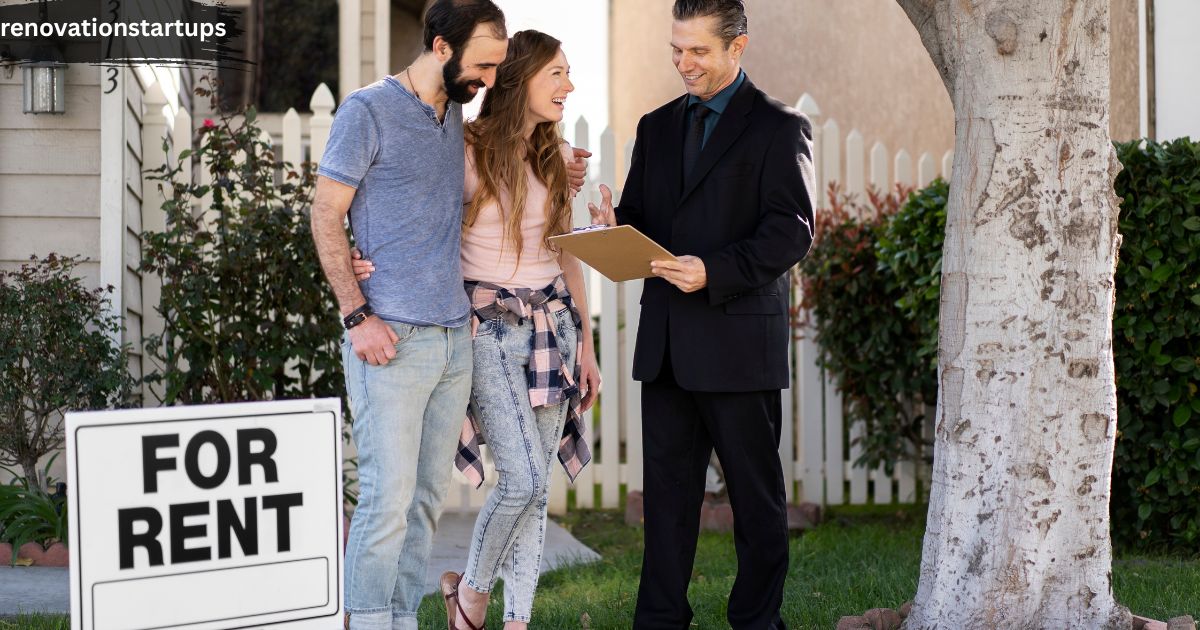 A real estate agent in a dark suit reviewing a rental application on a clipboard with a young couple on a grassy lawn next to a white picket fence and a prominent "FOR RENT" yard sign, demonstrating the process of finding houses to rent in near me.