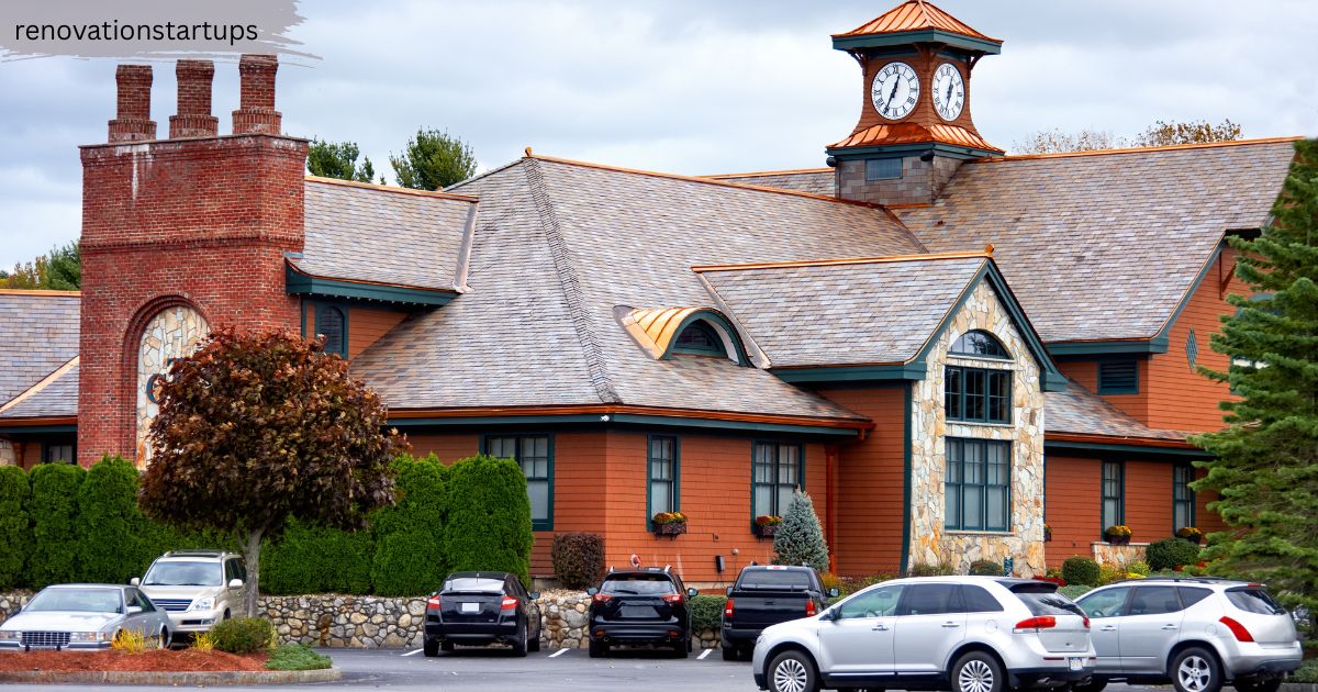 A beautiful Regina estate home with a multi-tiered slate roof, copper accents, and a distinctive clock tower, showcasing premium listings available on the MLS Regina market.