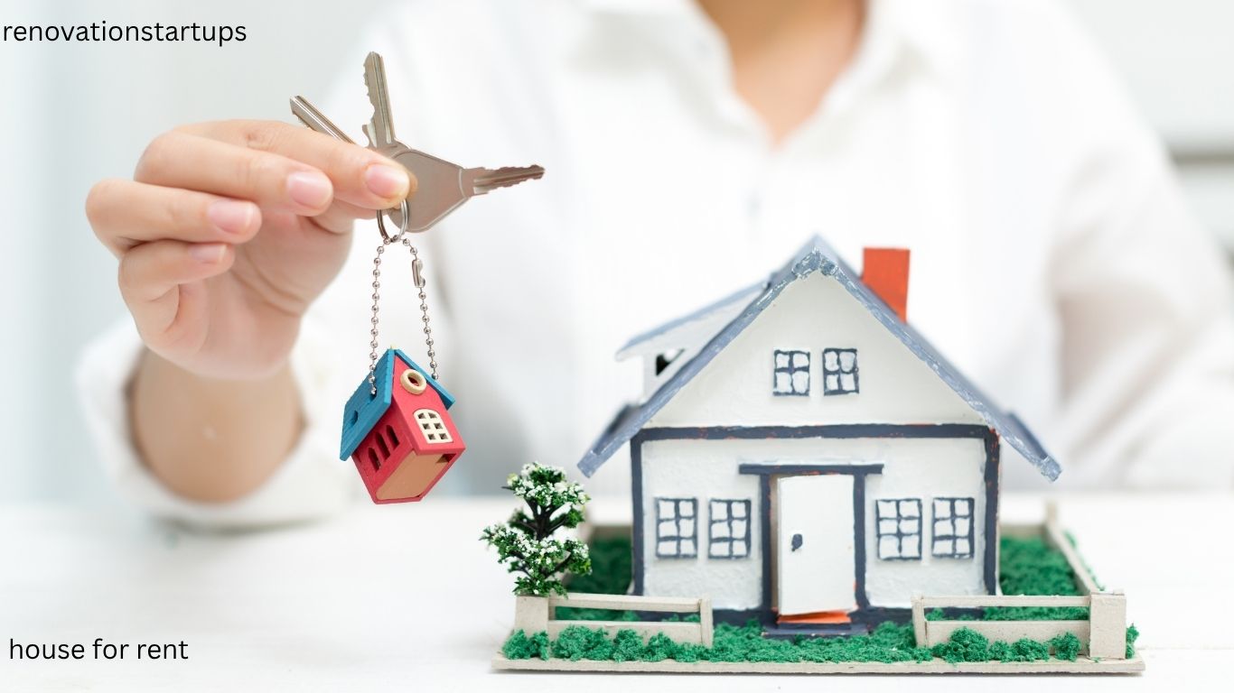 House keys being handed over next to a rental property model — find a house for rent in Canada