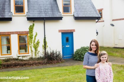Mother and daughter standing outside a home near 2125 Lynn Heights Dr, Pickering, with a blue front door and brick window trim.