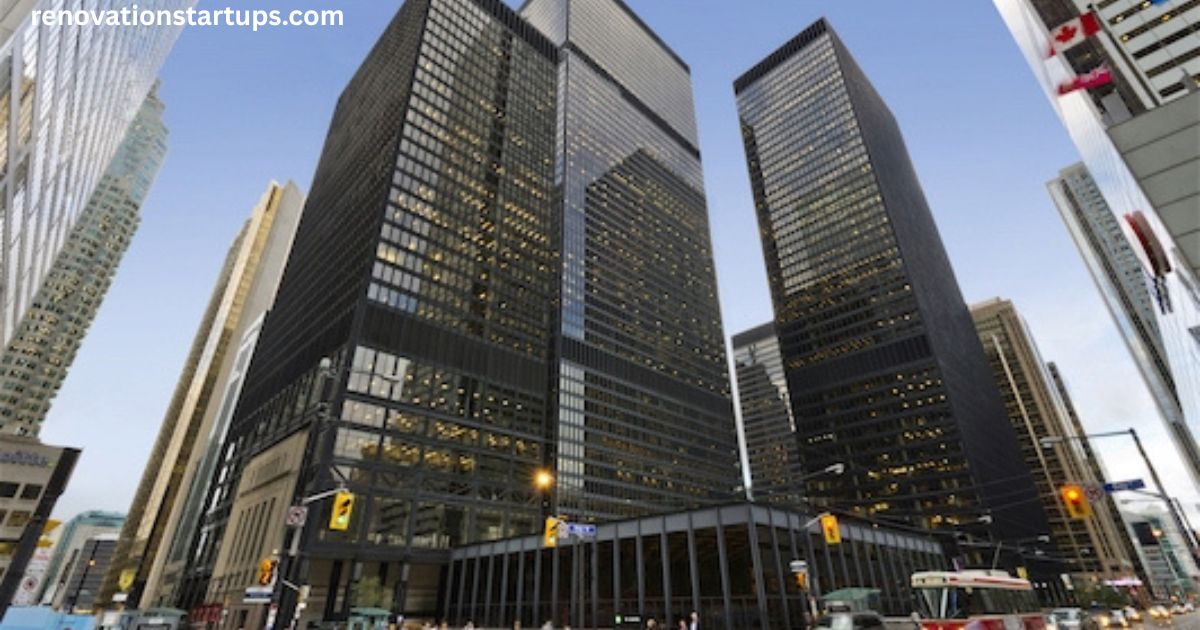 TD Bank Tower at 66 Wellington Street West in Toronto's Financial District, showing the dark glass-and-steel Toronto-Dominion Centre towers at dusk with street traffic below