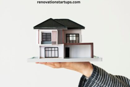 Person holding model house symbolizing houses for rent near me search