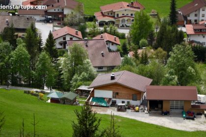 Houses for sale St Catharines Canada aerial view of a residential village with red and brown gabled rooftops and green hillside lawns