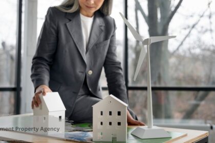 Government property agency concept a professional arranging small model buildings and a wind turbine on a table, representing sustainable public real estate management