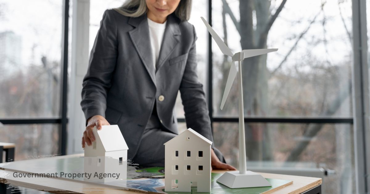 Government property agency concept a professional arranging small model buildings and a wind turbine on a table, representing sustainable public real estate management