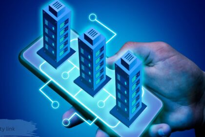 Hand holding smartphone with glowing digital property link connecting three miniature buildings, symbolizing real estate technology