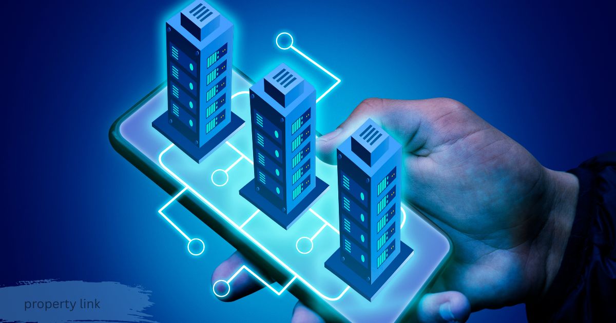 Hand holding smartphone with glowing digital property link connecting three miniature buildings, symbolizing real estate technology