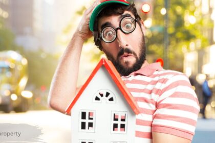 Surprised man holding a small toy house, illustrating confusion over an FGW lost property claim