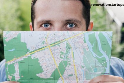 Man holding a folded city map over his face, illustrating how to find and navigate the 226 area code region in Southwestern Ontario