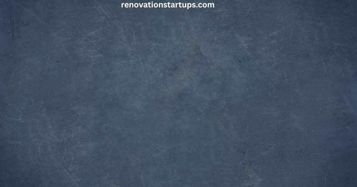 Close-up textured slate blue wall surface with a weathered, matte finish