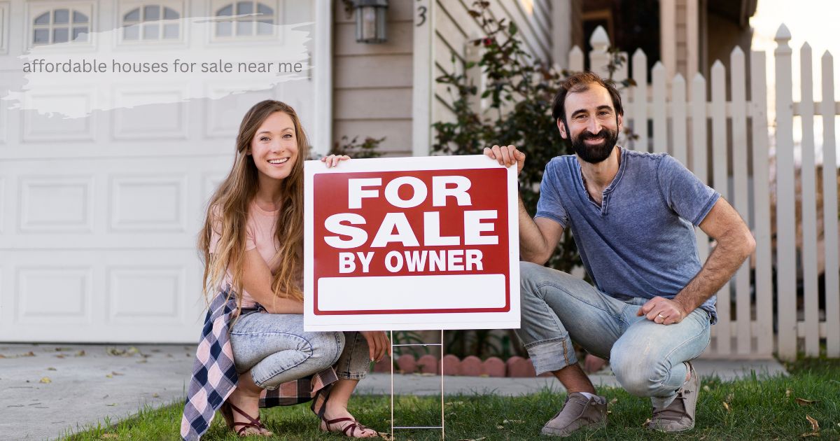 A smiling woman crouching in front of a house next to a red "For Sale By Owner" sign.’Affordable Houses for Sale Near Me’
