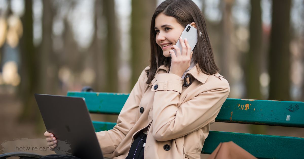Woman using laptop and talking on phone outdoors while comparing Hotwire Canada travel deals