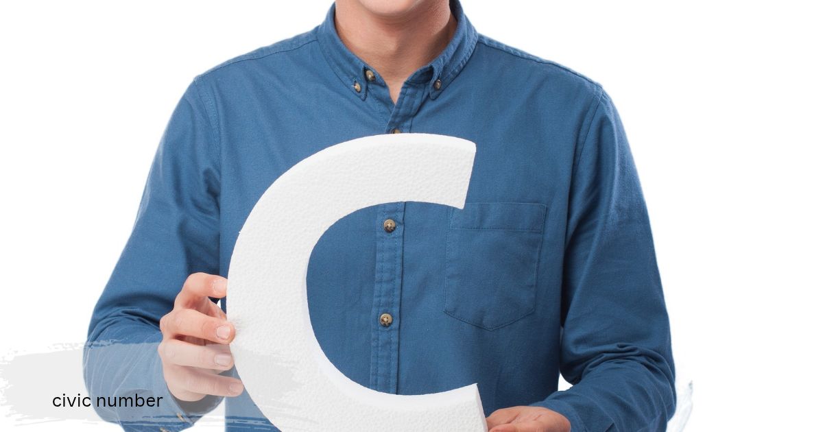 Man in a blue button up shirt holding a large civic number white foam letter civic number