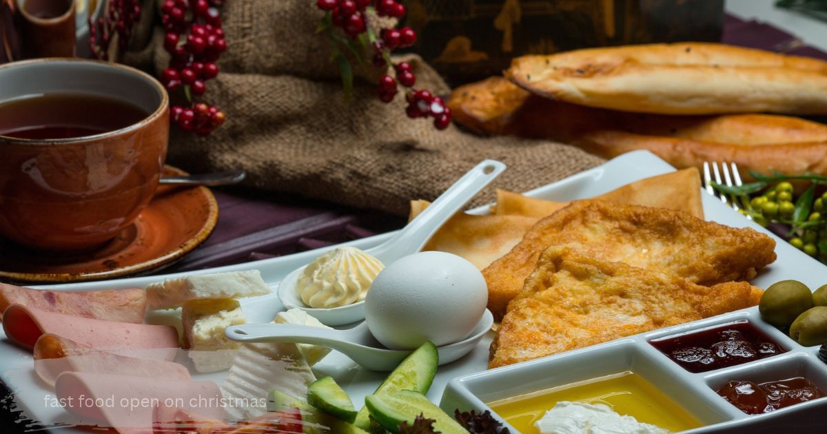 Christmas morning breakfast platter with tea, boiled egg, fried toast, ham, cheese, jam and fresh bread.” fast food open on christmas”