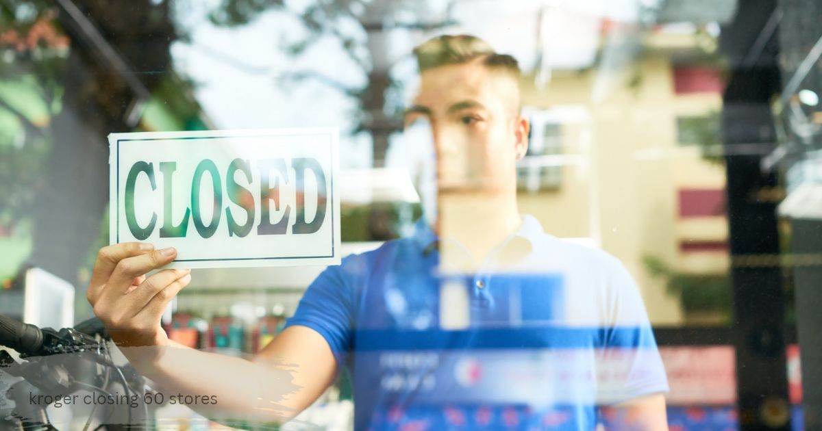 Store worker turning a closed sign on a shop door as Kroger shuts down 60 weaker supermarkets.” kroger closing 60 store”